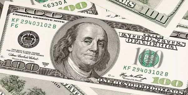 An American $100 bill featuring the face of Benjamin Franklin.