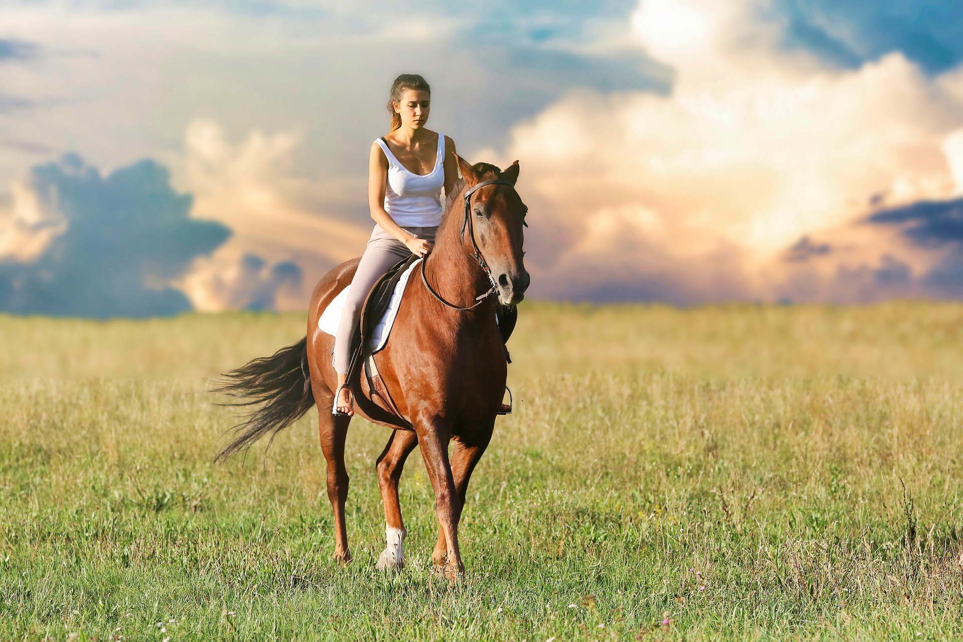 a woman riding a horse