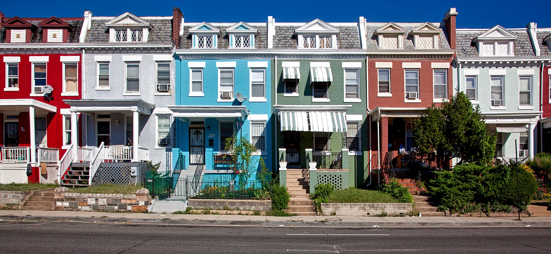 a row of different colored houses