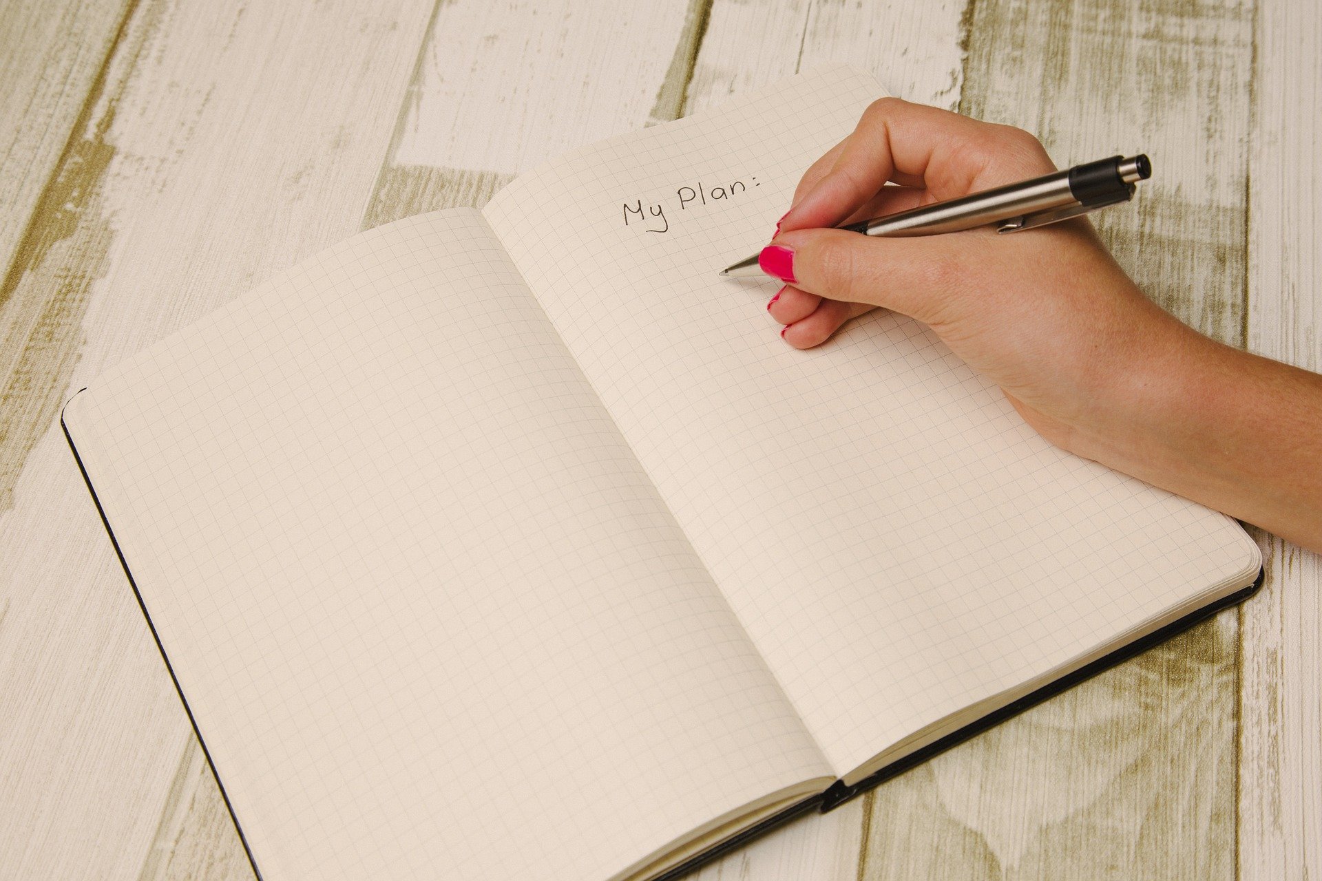 a hand writing in a notebook. The title is 'my plan'.